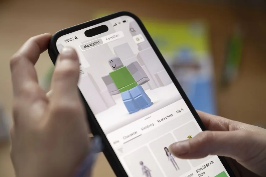 Person holding smartphone looking frustrated with screen
